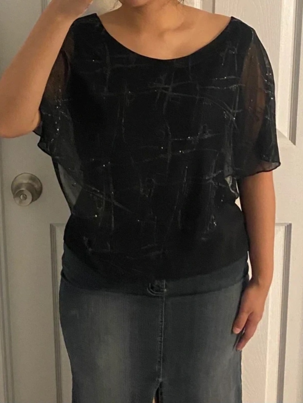 Black poncho blouse with sheer overlay